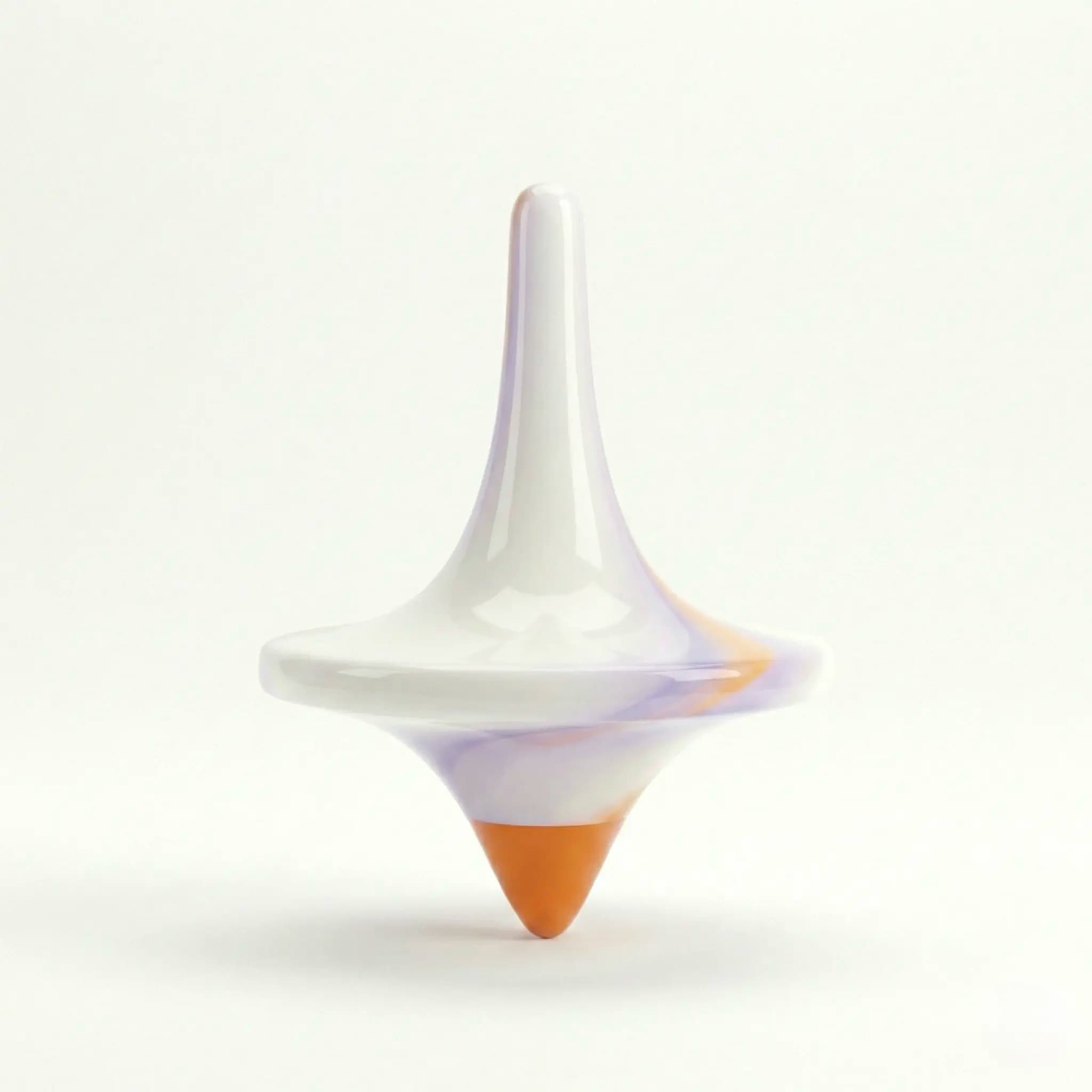 White and orange spinning top on a light background.