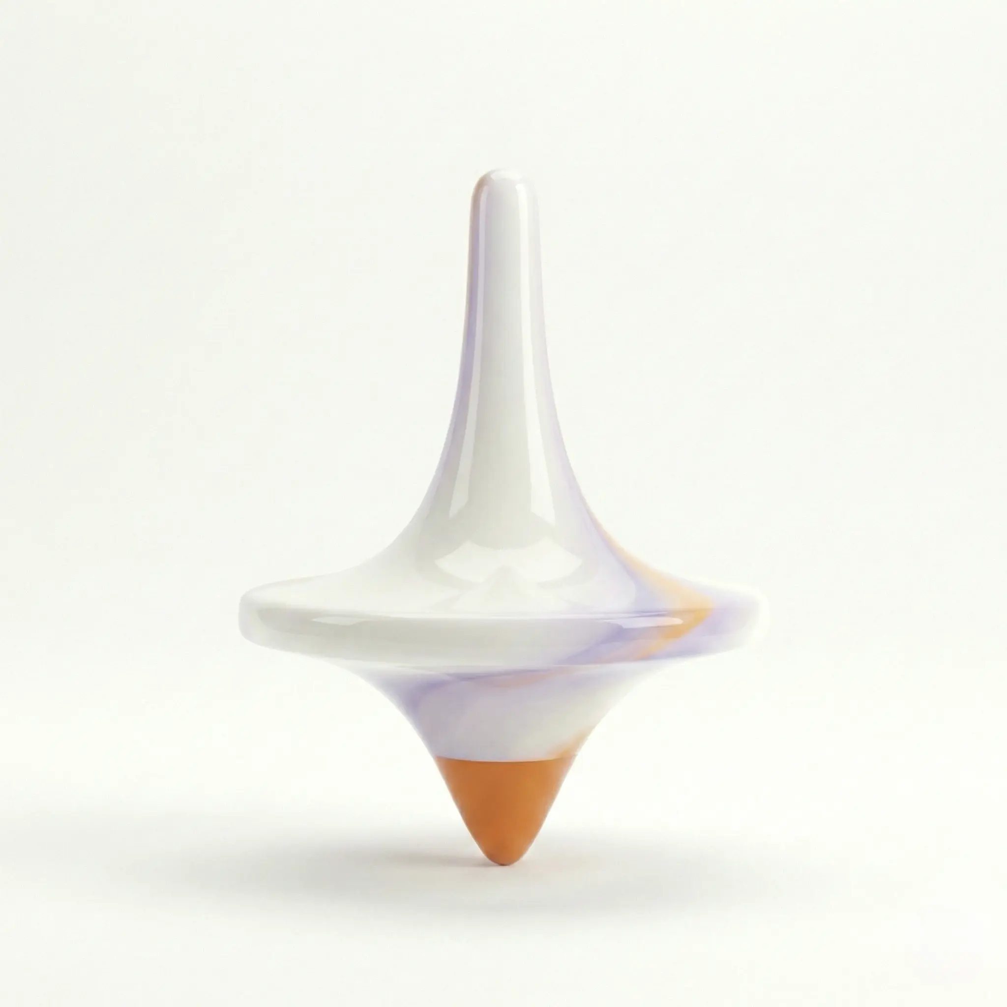 White and orange spinning top on a light background.